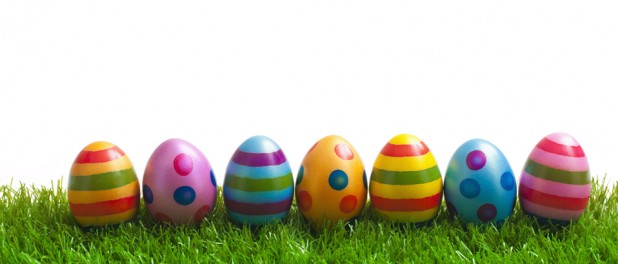 painted easter eggs lined up on grass